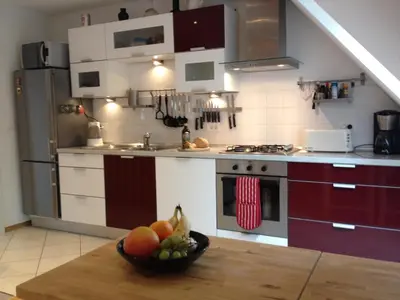 a kitchen with a bowl of fruit on a table at Chalet Floranneve in Bovec