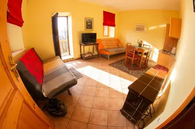 a living room with a couch and a table at Turistična kmetija Vrezner Apartment in Zgornja Kungota