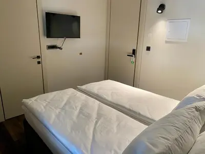 a hospital room with a bed and a flat screen tv at Boutique hotel ZBILJE in Zbilje