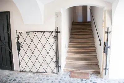 a stairway with a gate in a house at Apartment Bon Voyage in Maribor