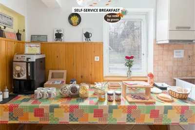 a kitchen with a table with food on it at Hostel Mama Minka in Bohinj