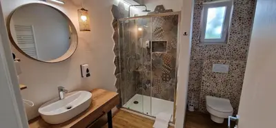 a bathroom with a sink and a shower at Hotel SAMARIN Črnomelj in Črnomelj