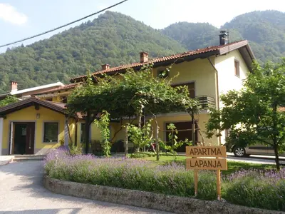 a house with a sign in front of it at Apartment Lapanja in Slappe dʼIdria