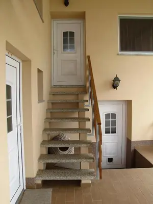 a set of stairs in a house with a door at Atera in Banovci