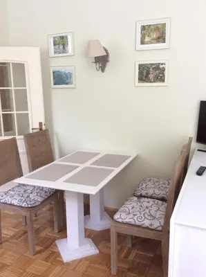 a table and two chairs in a room with a table at Vila Rogaška in Rogaška Slatina