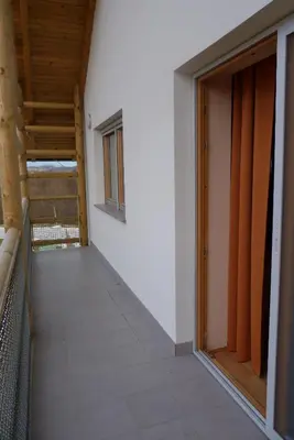 an empty hallway of a house with an open door at Guest House Eco Vila Mila in Rogaška Slatina
