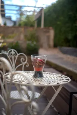 a cup sitting on top of a white table at Cute sunny apartment KOD1 in Ljubljana