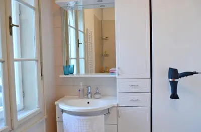 a bathroom with a sink and a mirror at Guesthouse Soul in Ljubljana