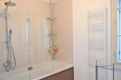 a bathroom with a shower and a bath tub at Guesthouse Soul in Ljubljana