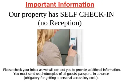 a woman is using a self checkin machine at Guesthouse Soul in Ljubljana