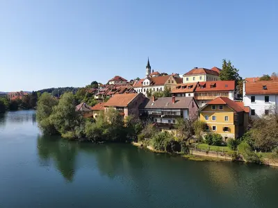 a view of a river with houses and buildings at Hostel Novak in Novo Mesto