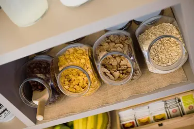 a drawer of a refrigerator filled with different types of food at Art Hotel in Ljubljana