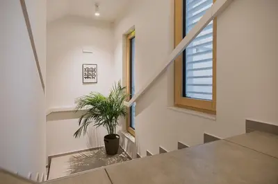 a staircase with a potted plant in a building at Art Hotel in Ljubljana