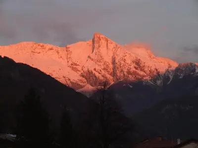 a mountain with a red light on top of it at Apartment Mlinarjeva domačija in Kobarid