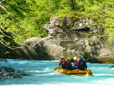 a group of people on a raft in a river at Apartment Pri nama in Bovec