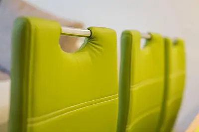 a row of green suitcases sitting next to each other at Podkoren Apartments in Kranjska Gora