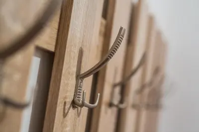 a metal door handle on a wooden door at Podkoren Apartments in Kranjska Gora
