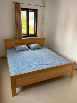a bed in a room with a window at 1A Adventure Hostel in Lesce