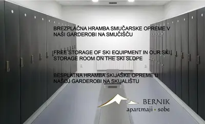 a locker room with a wall with writing on it at Apartment Bernik II in Kranjska Gora