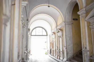 an empty hallway with an archway in a building at 4flats in Maribor