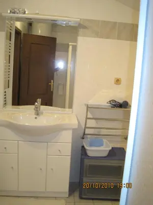 a bathroom with a sink and a mirror at Apartments Klabjan in Osp