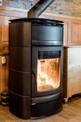 a oven with a fire inside of it at Hotel House Rozka in Cerklje na Gorenjskem
