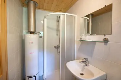 a bathroom with a sink and a shower and a sink at Miha lodge - Mihčevo pleče in Soča