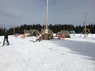 a group of people on skis in the snow at Apartment Gaber 82 in Zreče