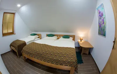 a bedroom with two beds in a room at Apartmaji Smogavc in Zreče