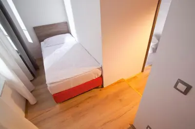 a small bedroom with a small bed in a room at B&B HOTEL Maribor UNI Hostel in Maribor