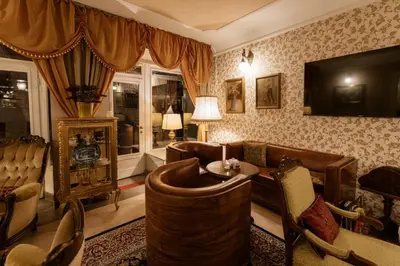 a living room with a couch and a table at Allegro Hotel in Ljubljana
