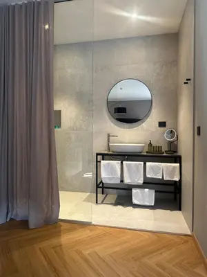 a bathroom with a sink and a mirror at Hotel DRAŠ in Maribor