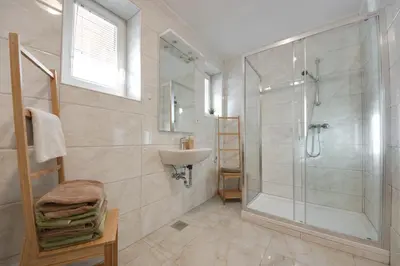 a bathroom with a shower and a sink at Apartments Julian Experience in Rateče
