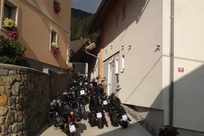 a row of motorcycles parked next to a building at Apartments Julian Experience in Rateče