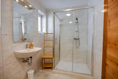 a bathroom with a shower and a sink at Apartments Julian Experience in Rateče
