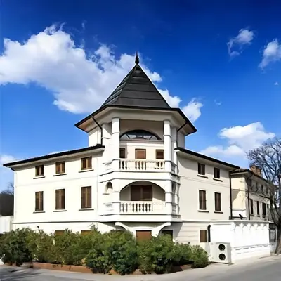 a white building with a black roof at Hotel Paquito in Nova Gorica