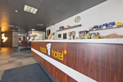 a lobby of a hotel with a reception counter at Bit Center Hotel in Ljubljana