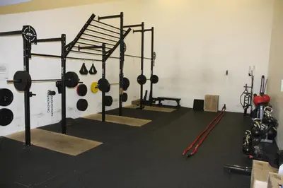 a gym with a bunch of equipment in a room at Bit Center Hotel in Ljubljana