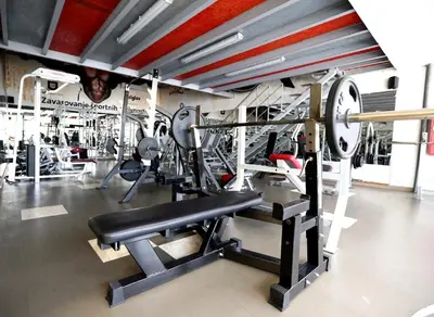a fitness room with a gym with tread machines at Bit Center Hotel in Ljubljana
