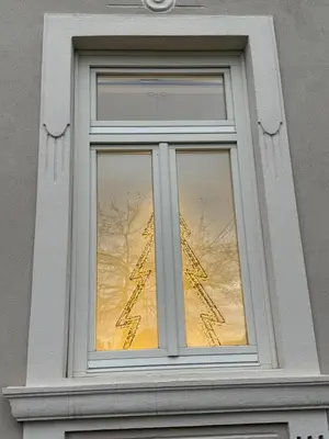 a window with a reflection of the eiffel tower at Vila Alice Bled - Adults only in Bled