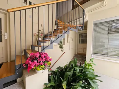a staircase in a house with potted plants at Jager Apartments Tour As Ljubljana in Ljubljana