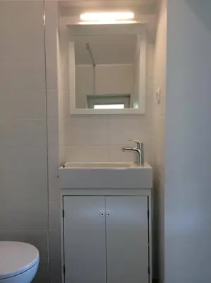a bathroom with a sink and a toilet at Guest House Vitaja in Bled
