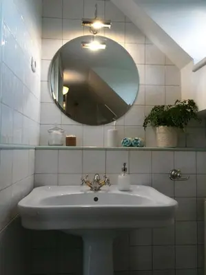 a bathroom with a sink and a mirror at Guest House Vitaja in Bled