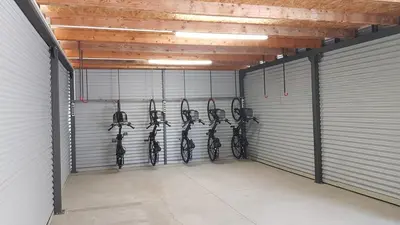 a garage with a bunch of horses in it at Hotel Pomaranča in Ptuj