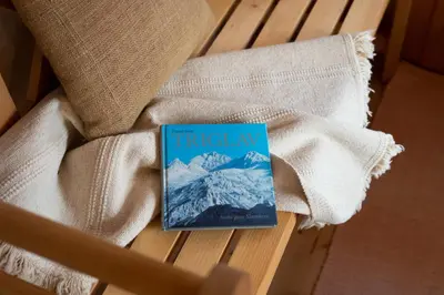 a book sitting on top of a pile of towels at Bezgova Hišica in Bovec