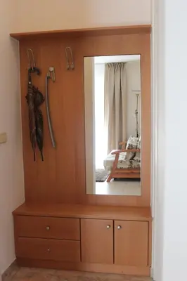 a mirror on top of a dresser in a room at Vila Weekend in Rogaška Slatina