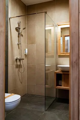 a bathroom with a shower and a toilet and a sink at Grmovškov dom Kope in Mislinja