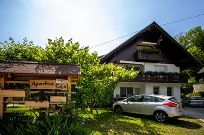 a car parked in front of a building at Apartmaji Colja in Bohinj