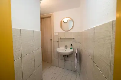 a bathroom with a sink and a mirror at Turistična kmetija Gartner in Bohinj
