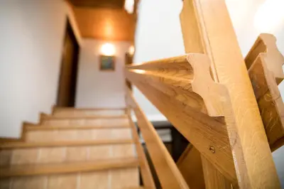 a view of a staircase with wooden railings at Turistična Kmetija Gartner 3a in Bohinj